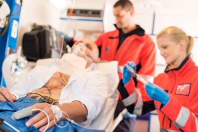 Paramedics and EMTs treating a patient